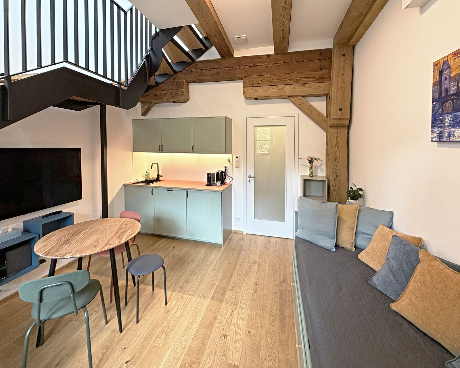 Living room with kitchenette and oak beams