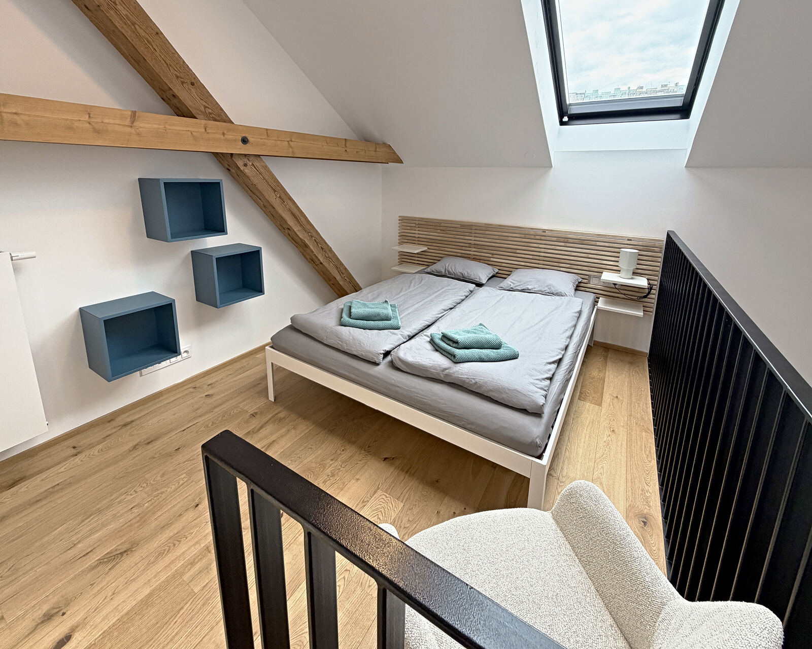 Gallery bedroom with a double bed and roof window