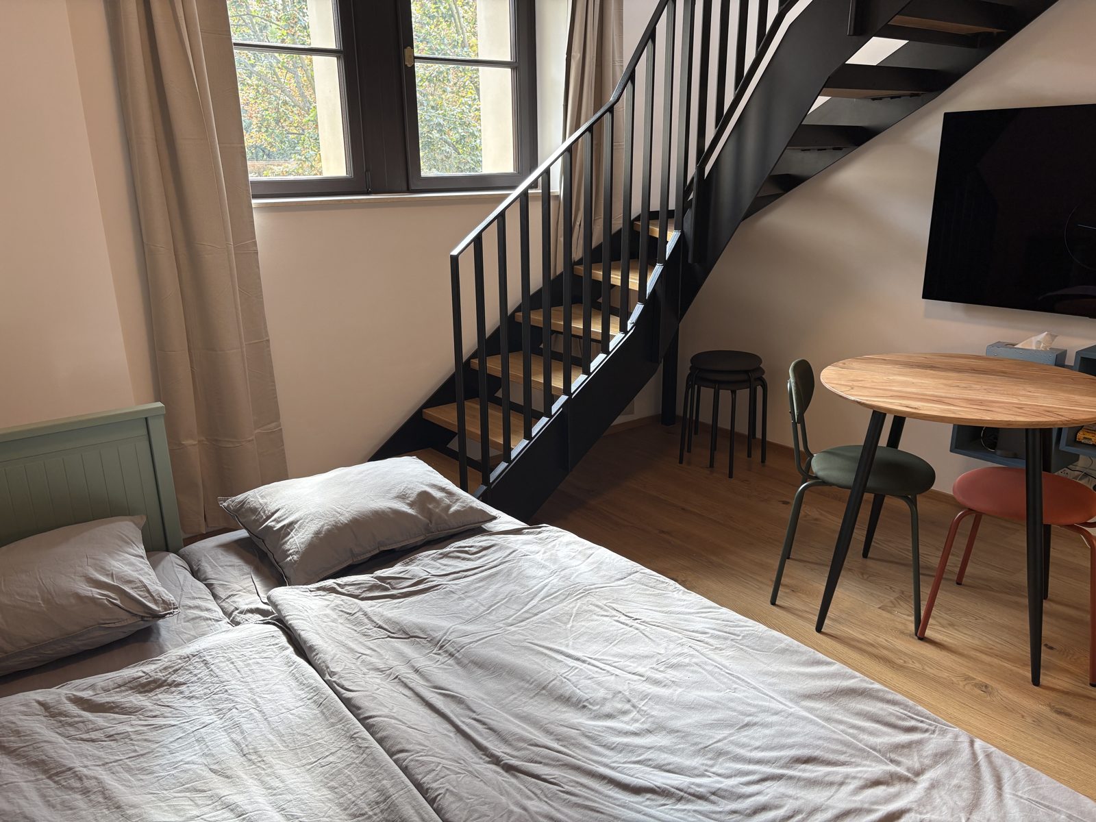 Sleeping in the living room by the stairs to the gallery